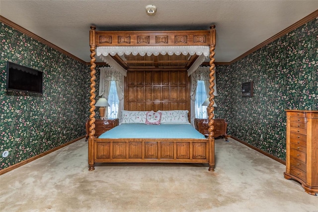 carpeted bedroom with a textured ceiling and crown molding