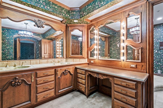 bathroom with crown molding, vanity, and a chandelier