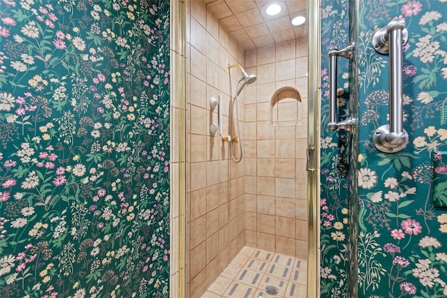 bathroom with a shower with shower door