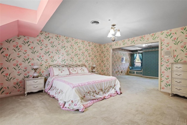 bedroom featuring an inviting chandelier and carpet floors