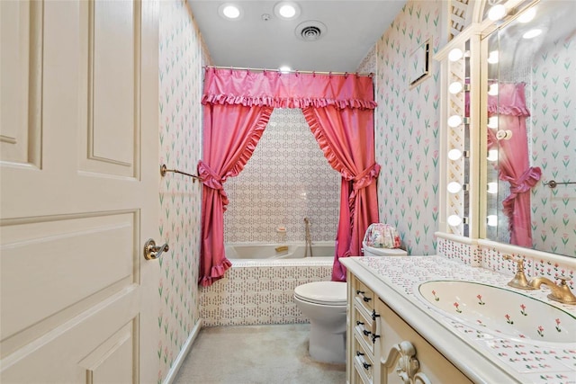 full bathroom featuring shower / bath combo, vanity, and toilet