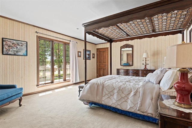 carpeted bedroom featuring ornamental molding