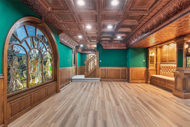 misc room with ornamental molding and light hardwood / wood-style flooring