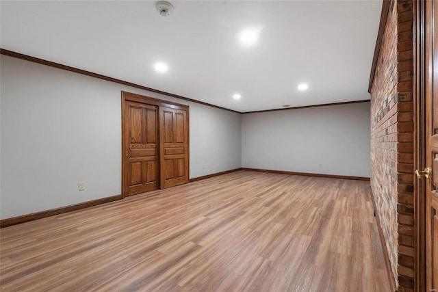 interior space with light hardwood / wood-style floors and ornamental molding