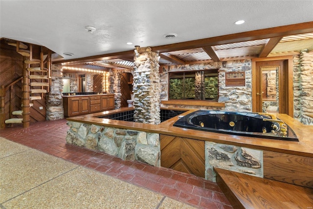 kitchen with a textured ceiling and beam ceiling