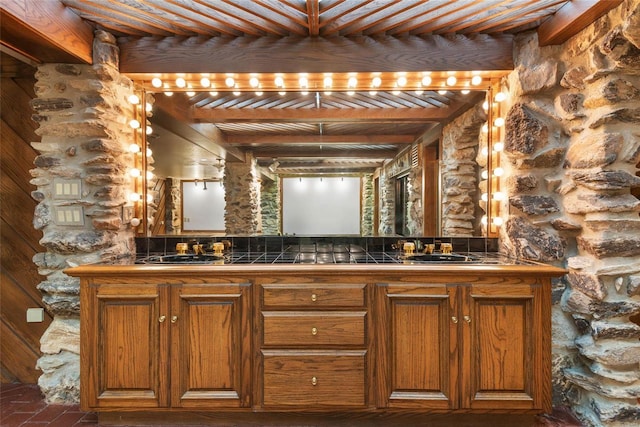 interior space with beamed ceiling, vanity, and wood ceiling