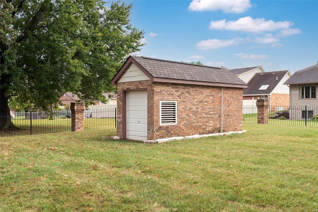 view of outbuilding featuring a lawn