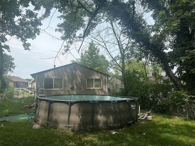 view of side of home with a yard