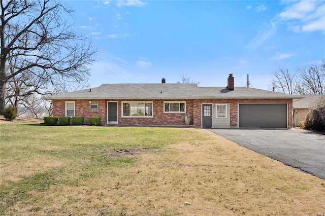 single story home featuring a garage and a front lawn