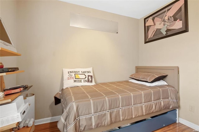 bedroom featuring hardwood / wood-style floors