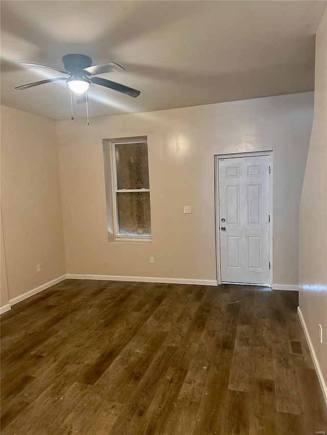 unfurnished room featuring dark hardwood / wood-style flooring and ceiling fan