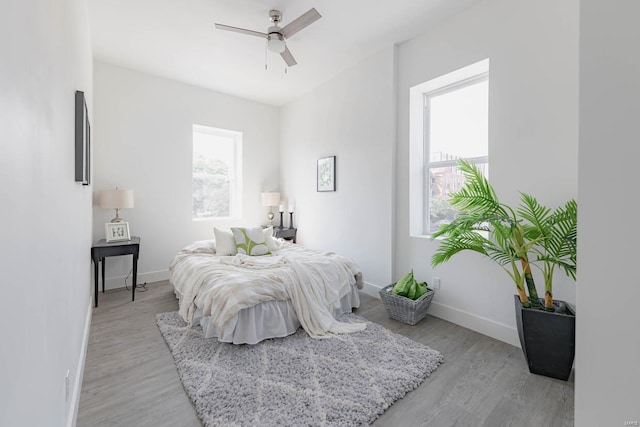 bedroom featuring ceiling fan and light hardwood / wood-style floors