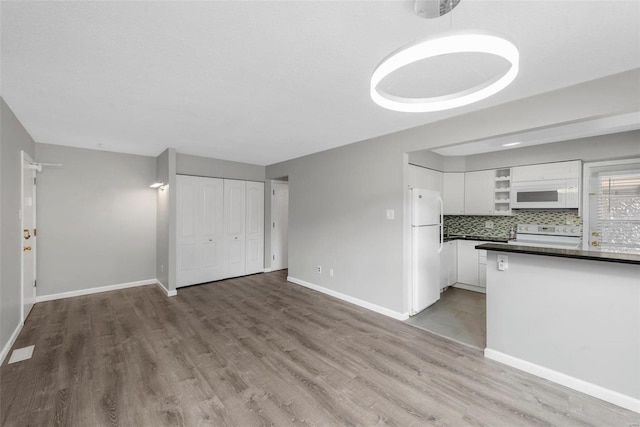 unfurnished living room with light hardwood / wood-style floors