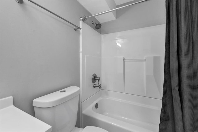 bathroom with shower / bath combo with shower curtain and toilet