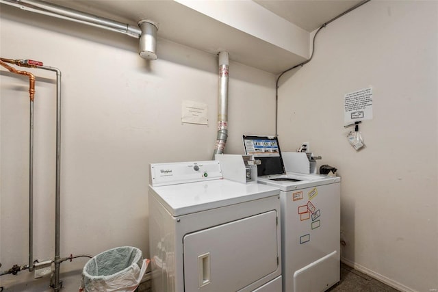 clothes washing area featuring independent washer and dryer