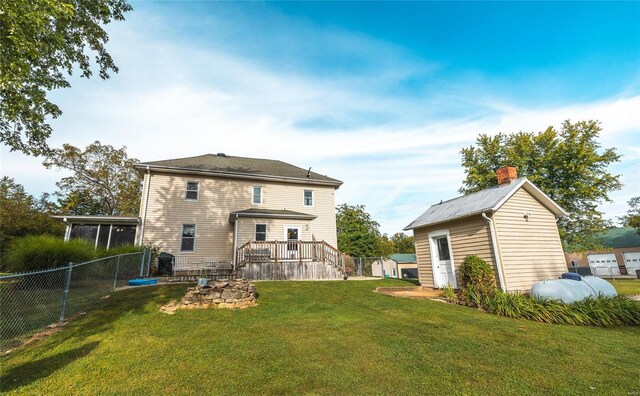 rear view of house with a yard