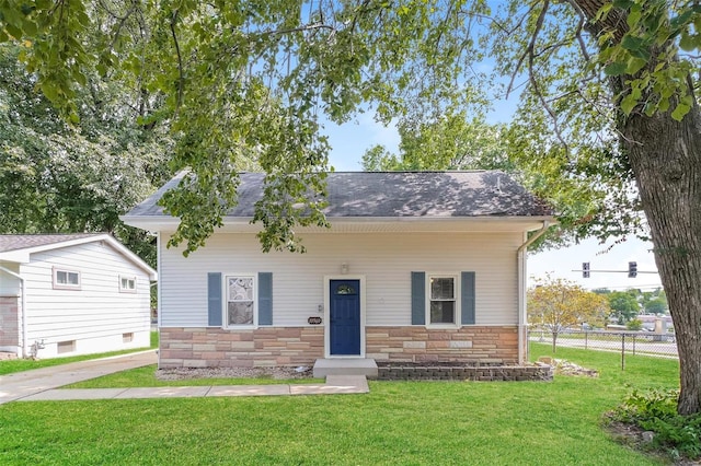 bungalow-style house featuring a front yard