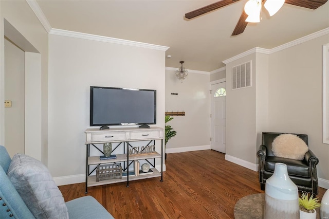 living room featuring hardwood / wood-style floors, ceiling fan, and ornamental molding