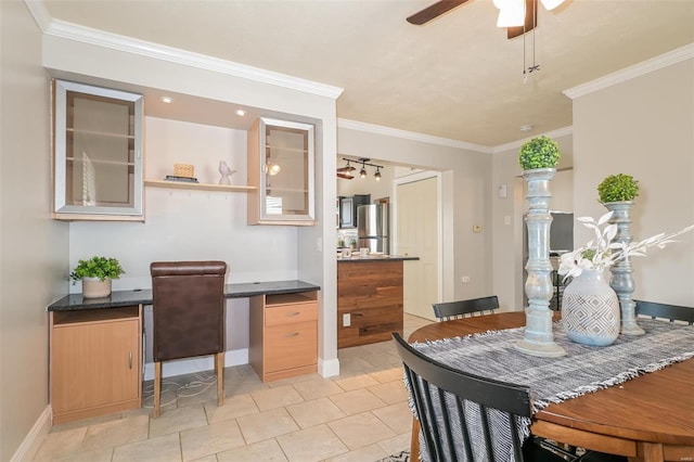 tiled dining space with ornamental molding and ceiling fan