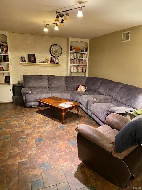 living room featuring rail lighting