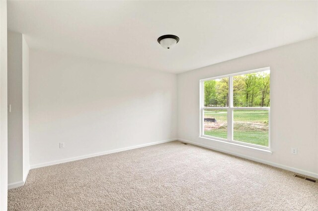 unfurnished room featuring carpet flooring