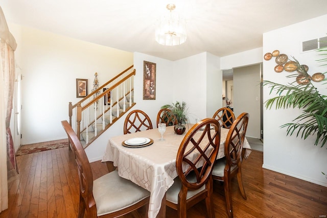 dining area with dark hardwood / wood-style flooring