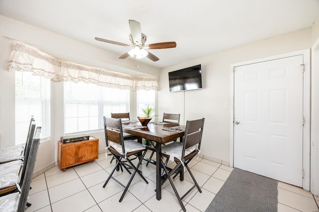 dining room with light tile patterned flooring and ceiling fan