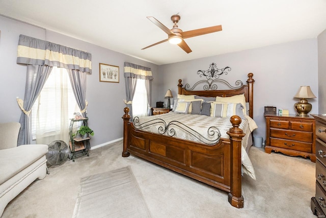 bedroom featuring light colored carpet and ceiling fan