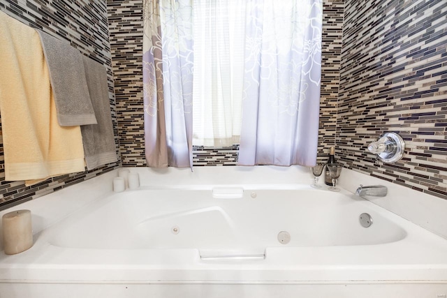 bathroom featuring a tub to relax in