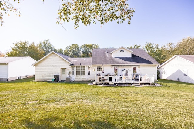 back of house with a patio area, central AC, and a yard