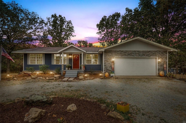 ranch-style home featuring a garage