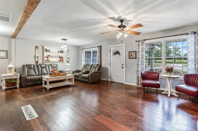 living room featuring ceiling fan and dark wood-type flooring