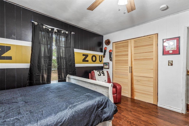 bedroom featuring ceiling fan and dark wood-type flooring