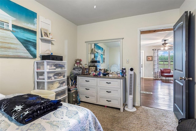 bedroom featuring dark carpet