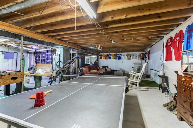 recreation room featuring concrete flooring