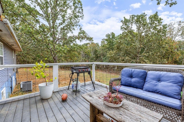 wooden deck featuring central AC and outdoor lounge area