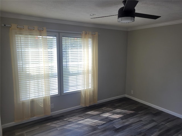 spare room with dark wood-type flooring, ceiling fan, a textured ceiling, and ornamental molding