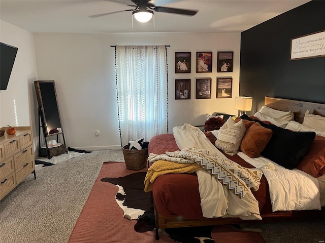 bedroom featuring ceiling fan and carpet