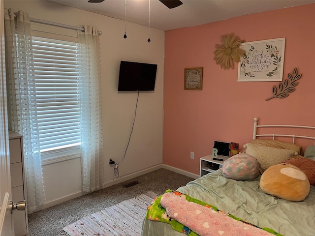 carpeted bedroom featuring ceiling fan