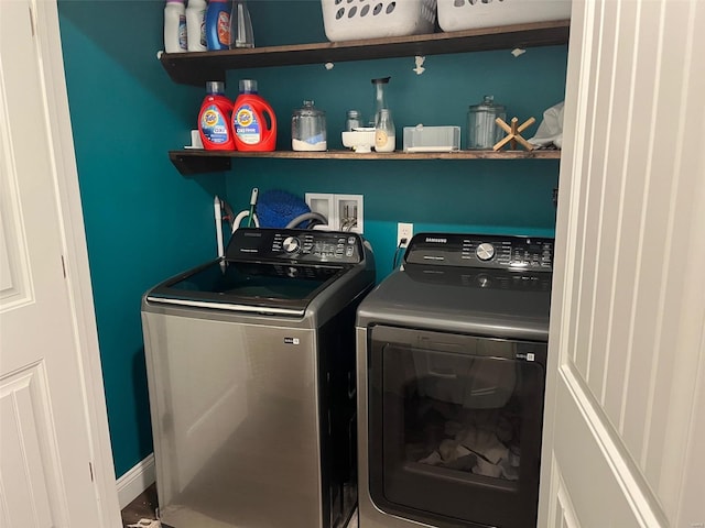 clothes washing area featuring washer and dryer