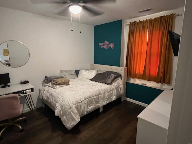 bedroom featuring ceiling fan and dark hardwood / wood-style floors