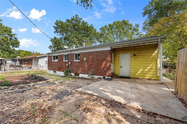 back of property with a patio