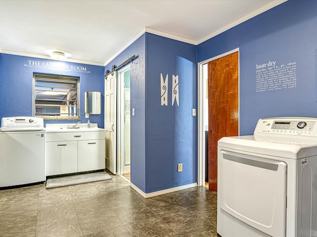 clothes washing area with crown molding, a barn door, cabinets, sink, and independent washer and dryer