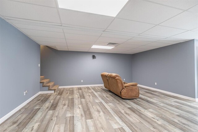 unfurnished room with light hardwood / wood-style flooring and a drop ceiling