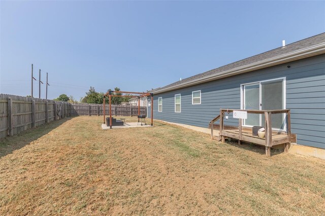 view of yard featuring a wooden deck