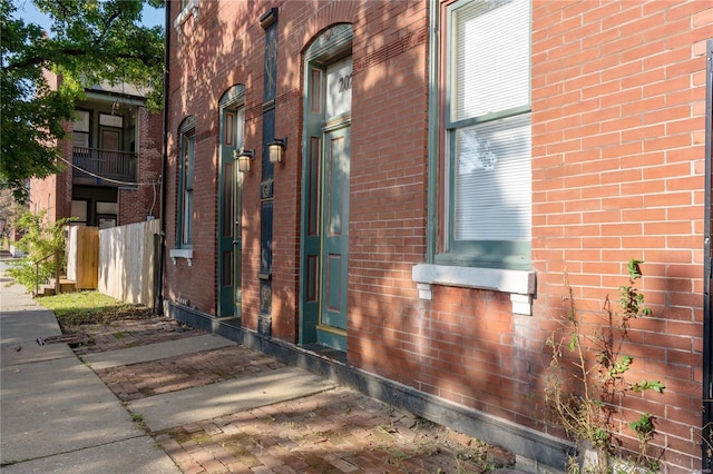 view of side of home featuring a balcony