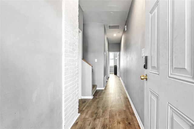 corridor featuring dark wood-type flooring