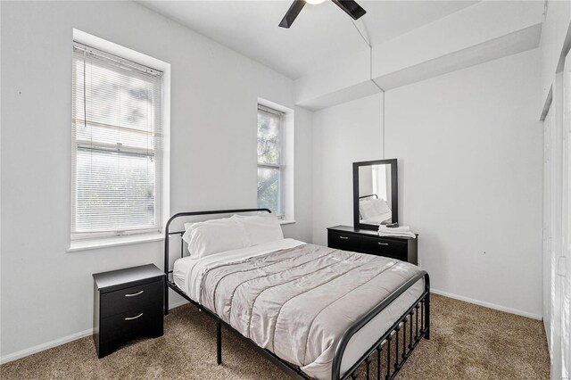 bedroom featuring ceiling fan and carpet flooring