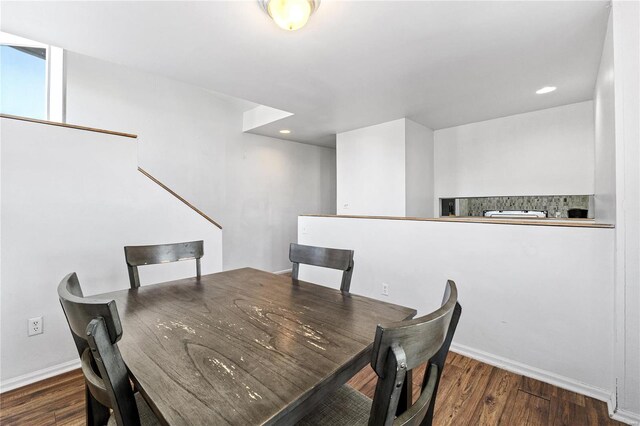 dining room with dark hardwood / wood-style floors