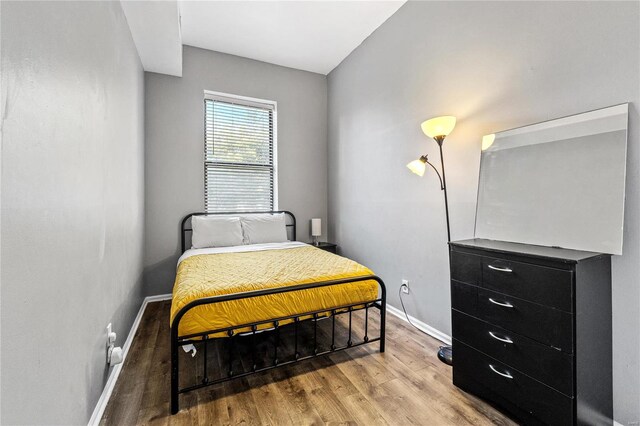 bedroom featuring hardwood / wood-style flooring